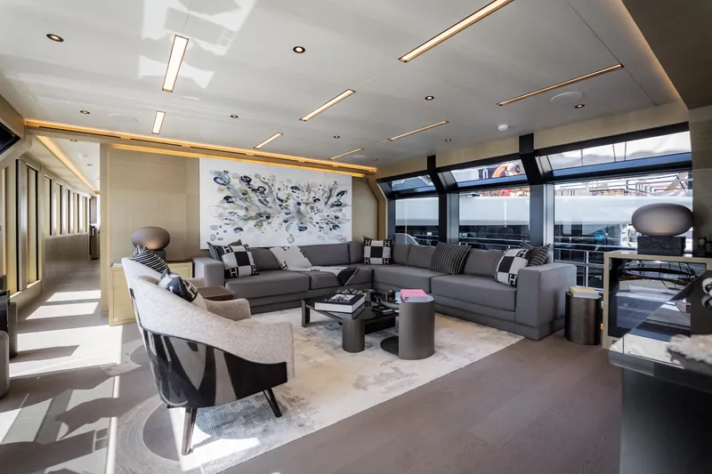 Slide: The Image of Luxurious yacht interior with modern decor, featuring a spacious seating area and large windows. - 24