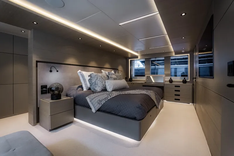 Slide: The Image of Luxurious bedroom interior in 2020 Alpha Alfresco 125 yacht, featuring modern design and ambient lighting. - 25