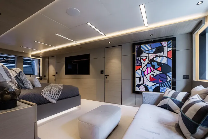 Slide: The Image of Luxurious bedroom interior on Alpha Alfresco 125 yacht, featuring modern art and elegant furnishings. - 28