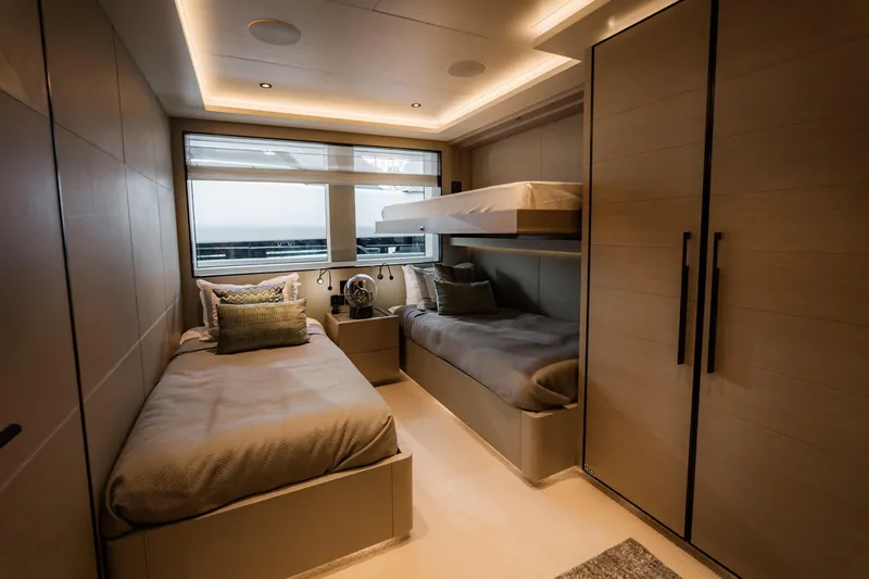 Slide: The Image of Luxurious cabin interior of 2020 Alpha Alfresco 125 yacht with modern twin beds and ambient lighting. - 34