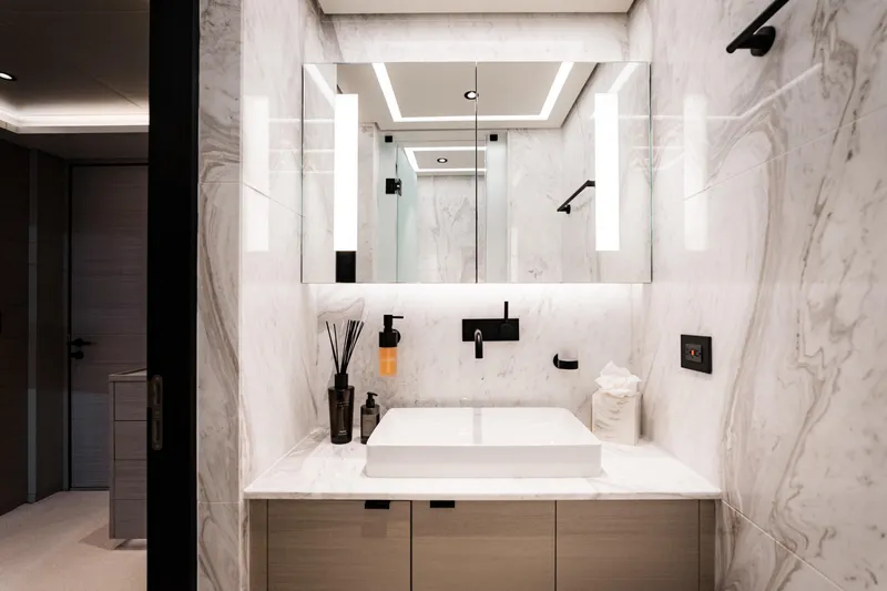 Slide: The Image of Modern bathroom with marble walls, sleek fixtures, and ambient lighting in an Alpha Alfresco 125, 2020 model. - 35