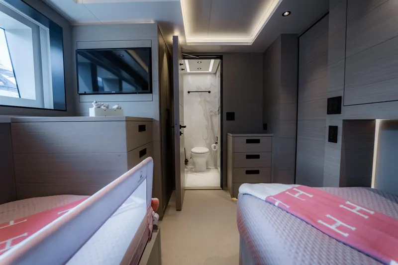 Slide: The Image of Modern yacht bedroom with ensuite bathroom, featuring sleek design and luxurious amenities, Alpha Alfresco 125. - 37