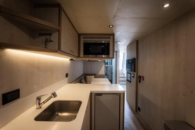 Slide: The Image of Modern kitchen interior in 2020 Alpha Alfresco 125 yacht, featuring sleek design and appliances. - 40