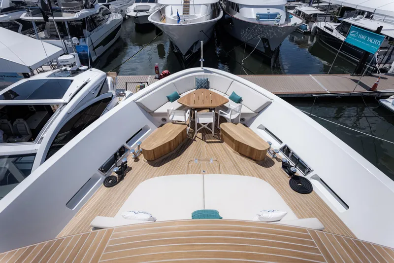 Slide: The Image of Luxurious 2020 Alpha Alfresco 125 yacht deck with seating and table at marina. - 9