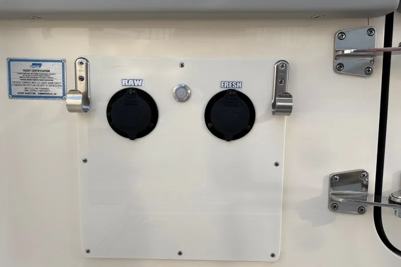 Slide: The Image of Water inlets on a 2023 Scout 330 LXF boat. - 18