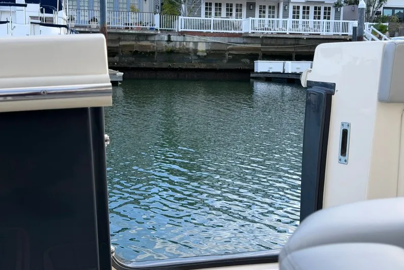 Slide: The Image of View from 2023 Scout 330 LXF of calm water and buildings. - 19