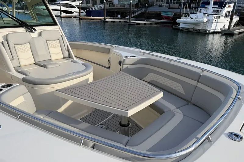 Slide: The Image of Luxurious seating area on a 2023 Scout 330 LXF boat. - 22