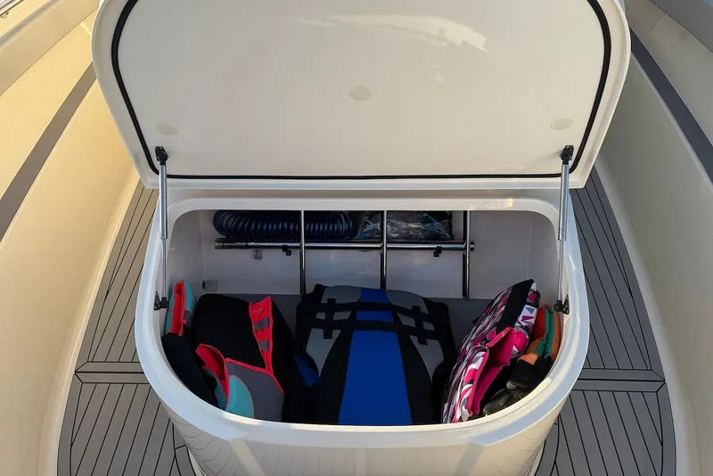 Slide: The Image of Storage compartment in Scout 330 LXF boat with life jackets. - 25