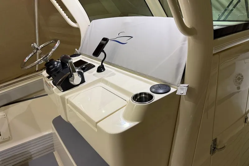 Slide: The Image of Helm station of the 2023 Scout 330 LXF boat. - 28