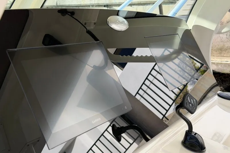 Slide: The Image of Scout 330 LXF 2023 boat console with Garmin display. - 30