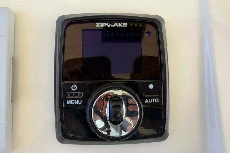 Slide: The Image of Zipwake control on 2023 Scout 330 LXF boat. - 35