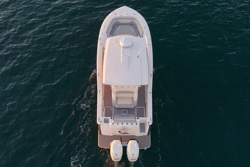 Slide: The Image of Scout 330 LXF 2023 boat on open sea from above. - 4