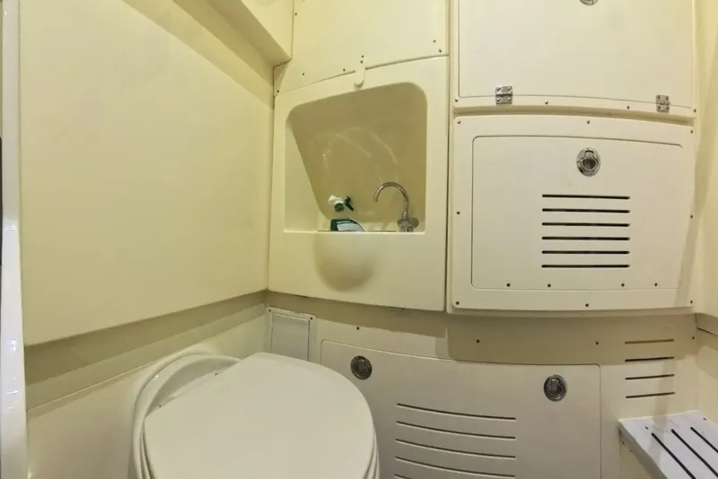 Slide: The Image of Interior of 2023 Scout 330 LXF featuring toilet and sink. - 49