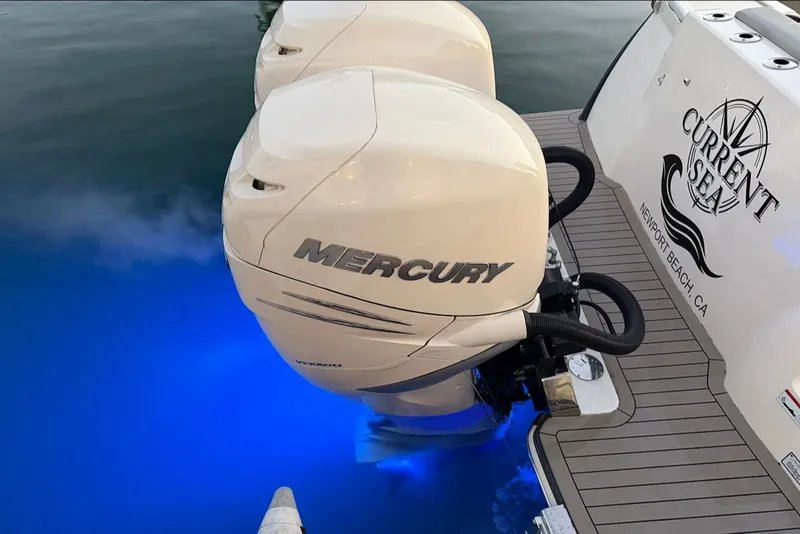 Slide: The Image of Scout 330 LXF 2023 with Mercury engines and blue underwater lighting. - 8