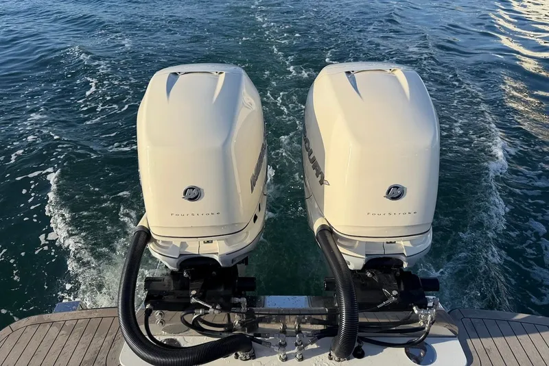 Slide: The Image of Two outboard engines on a 2023 Scout 330 LXF boat. - 9