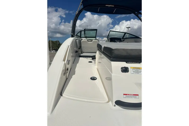 Slide: The Image of 2022 Sea Ray SPX 210 Outboard boat on trailer in parking lot. - 6