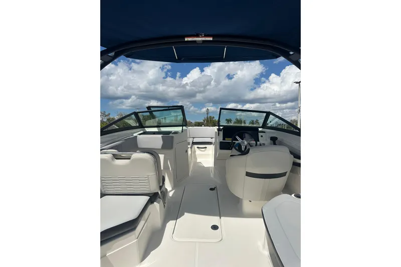 Slide: The Image of 2022 Sea Ray SPX 210 Outboard with Mercury engine in a parking lot. - 9