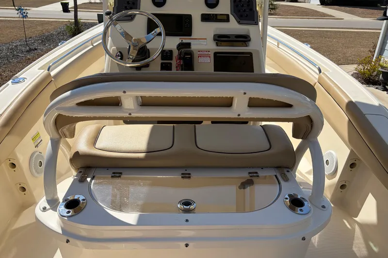 Slide: The Image of 2017 Scout 225 XSF boat interior with steering wheel and seating area. - 16