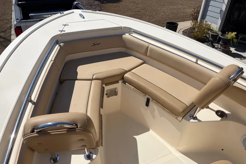 Slide: The Image of 2017 Scout 225 XSF boat with beige seating and stainless steel railings. - 20