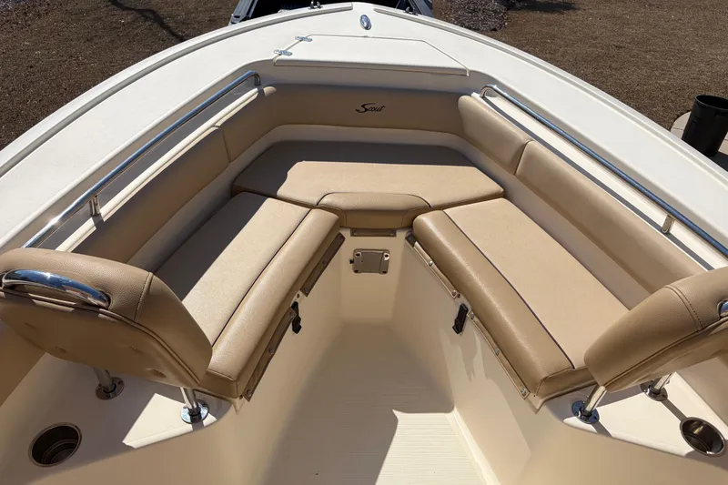 Slide: The Image of 2017 Scout 225 XSF boat interior with beige cushioned seating and stainless steel railings. - 21
