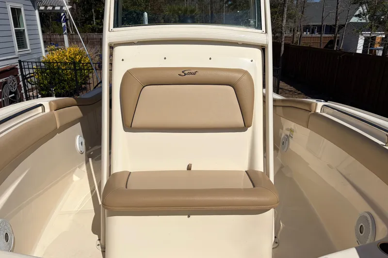 Slide: The Image of 2017 Scout 225 XSF boat interior with tan seating and white console. - 22