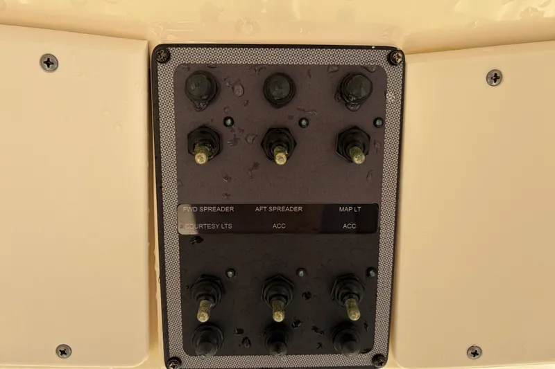Slide: The Image of Control panel of a 2017 Scout 225 XSF boat with labeled switches. - 29