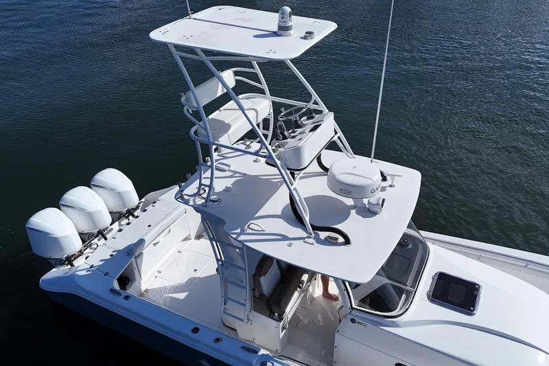 Slide: The Image of 2017 Edgewater 368CC boat with tower and four outboard engines on water. - 20