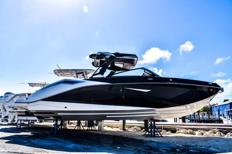 The Image of 2024 Scarab 285 ID boat on stands outdoors. - 0