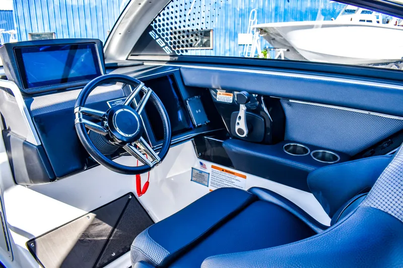 Slide: The Image of Interior of 2024 Scarab 285 ID with black seating. - 11