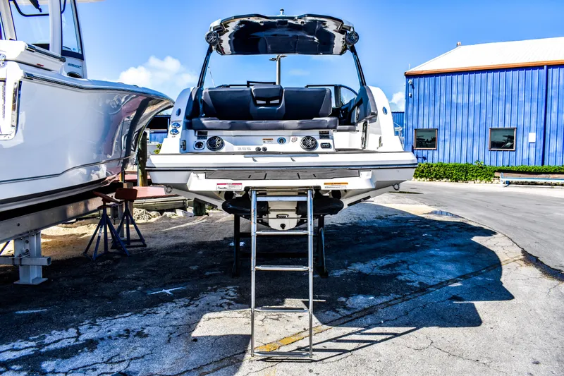 Slide: The Image of 2024 Scarab 285 ID boat with seating area and speakers. - 2