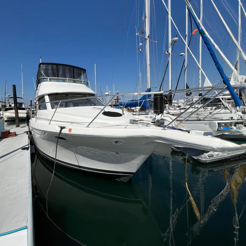 The Image of 1996 Bayliner 3788 Command Bridge Motoryacht docked at marina. - 0
