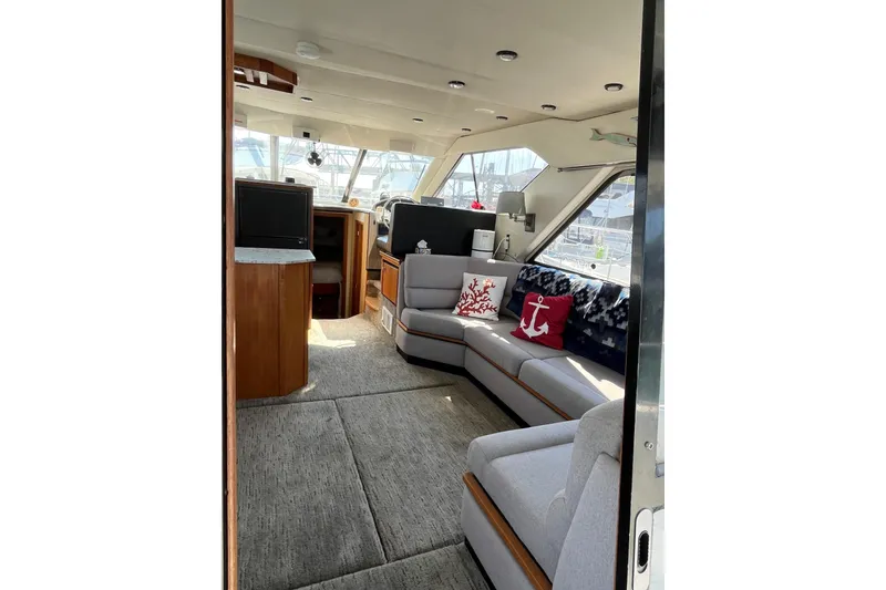 Slide: The Image of Interior of 1996 Bayliner 3788 Command Bridge Motoryacht with cozy seating and nautical decor. - 10