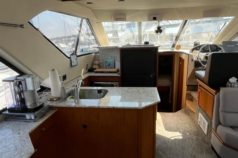 Slide: The Image of Interior of 1996 Bayliner 3788 Command Bridge Motoryacht with kitchen and helm station. - 16