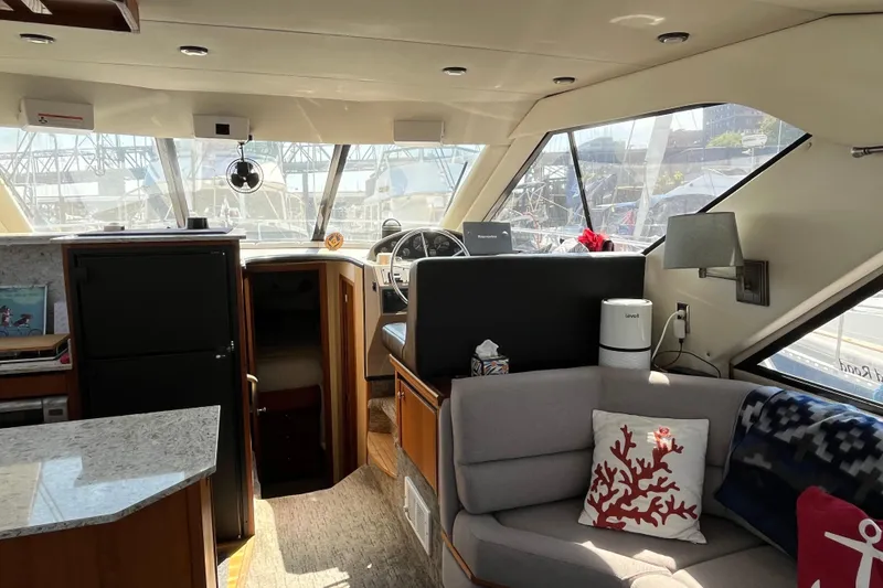 Slide: The Image of Interior of 1996 Bayliner 3788 Command Bridge Motoryacht with modern furnishings and helm. - 18