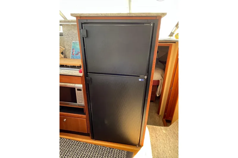 Slide: The Image of Black refrigerator in 1996 Bayliner 3788 Command Bridge Motoryacht interior. - 20