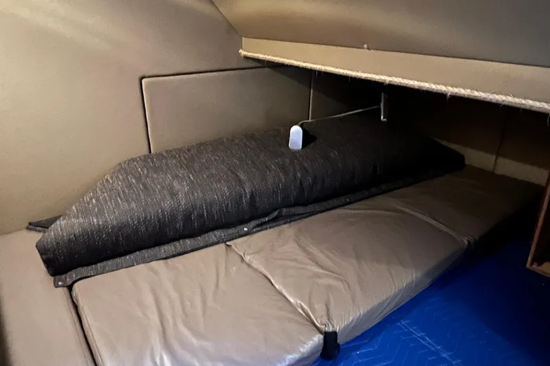 Slide: The Image of 1996 Bayliner 3788 Command Bridge Motoryacht interior cabin with cushioned seating. - 28