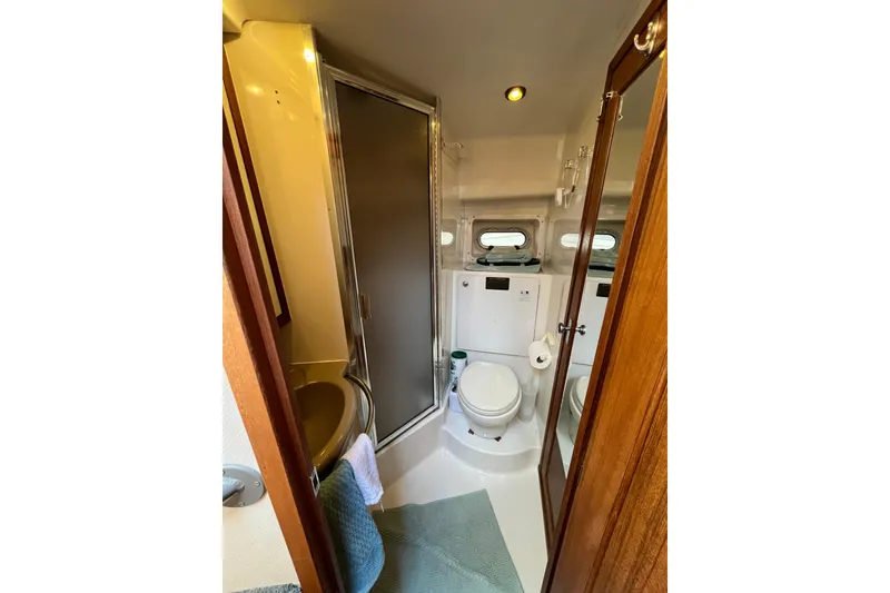Slide: The Image of Bathroom interior of 1996 Bayliner 3788 Command Bridge Motoryacht with shower and toilet. - 30