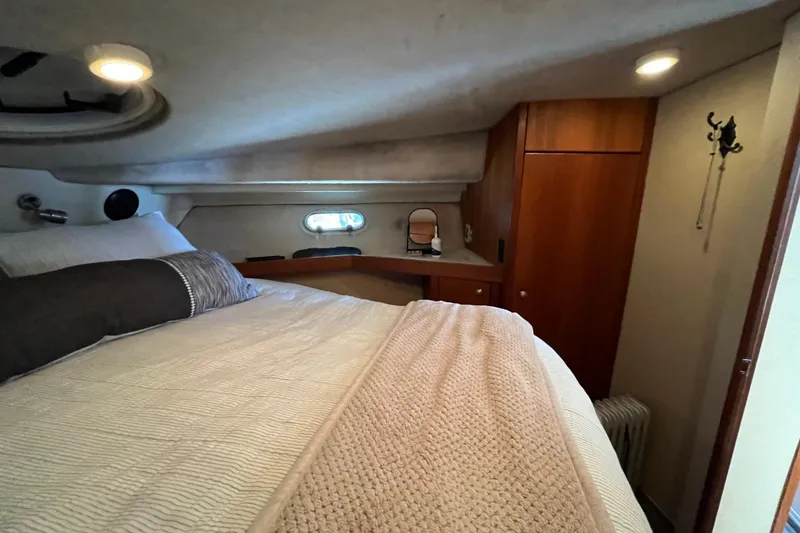 Slide: The Image of Cozy bedroom in 1996 Bayliner 3788 Command Bridge Motoryacht with elegant wood cabinetry. - 36