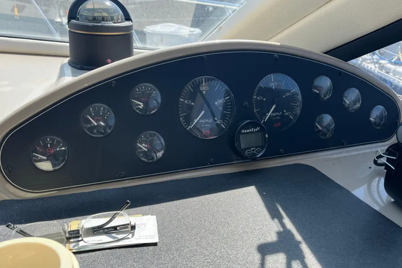 Slide: The Image of 1996 Bayliner 3788 Command Bridge Motoryacht dashboard with gauges and compass. - 39