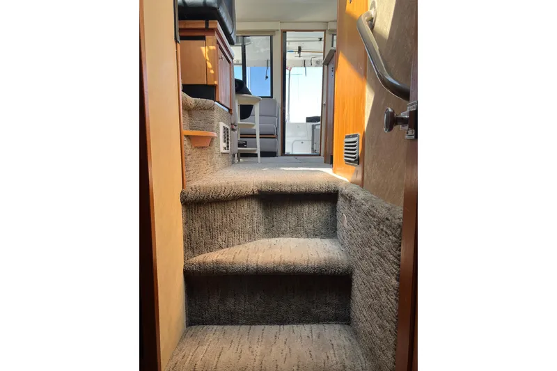 Slide: The Image of Interior stairs of 1996 Bayliner 3788 Command Bridge Motoryacht, leading to upper deck. - 40
