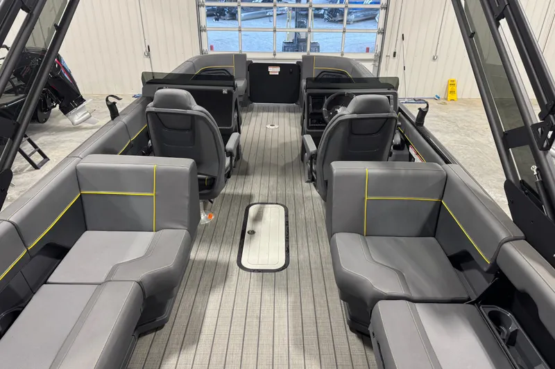 Slide: The Image of 2024 Manitou 24 Explorer interior with modern seating and sleek design. - 8