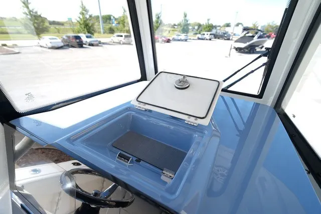 Slide: The Image of Cobia 245 Center Console 2027: Helm station with clear view and convenient storage. - 26