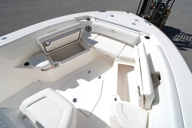Slide: The Image of Cobia 245 Center Console 2027: Spacious bow area with cushioned seating and storage. - 28