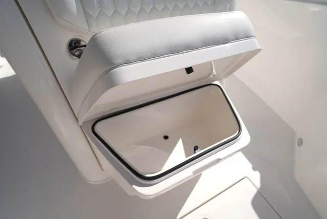 Slide: The Image of An open storage compartment on a 2027 Cobia 245 Center Console boat. - 31