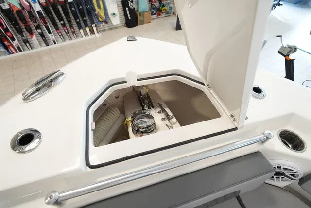 Slide: The Image of The 2027 Cobia 265 Center Console features an open storage area in the bow with a windlass. - 47