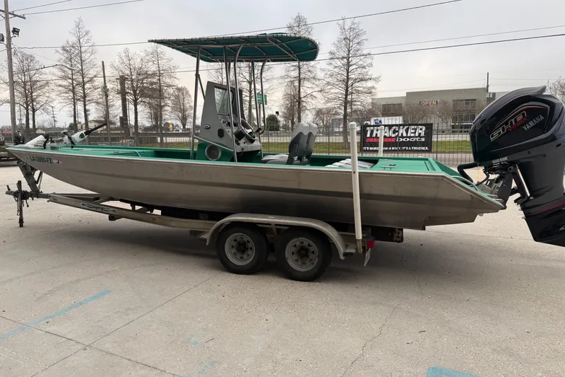 Slide: The Image of Aluminum fishing boat on trailer, Charles Leonard 24 model, 2012, with Yamaha outboard motor. - 5