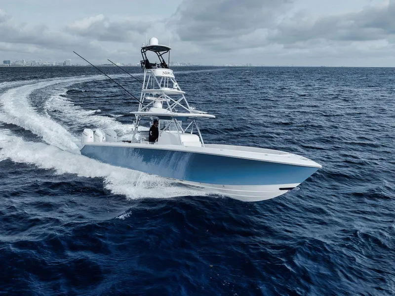 The Image of 2010 Bahama 41 boat cruising on open ocean under cloudy skies. - 0