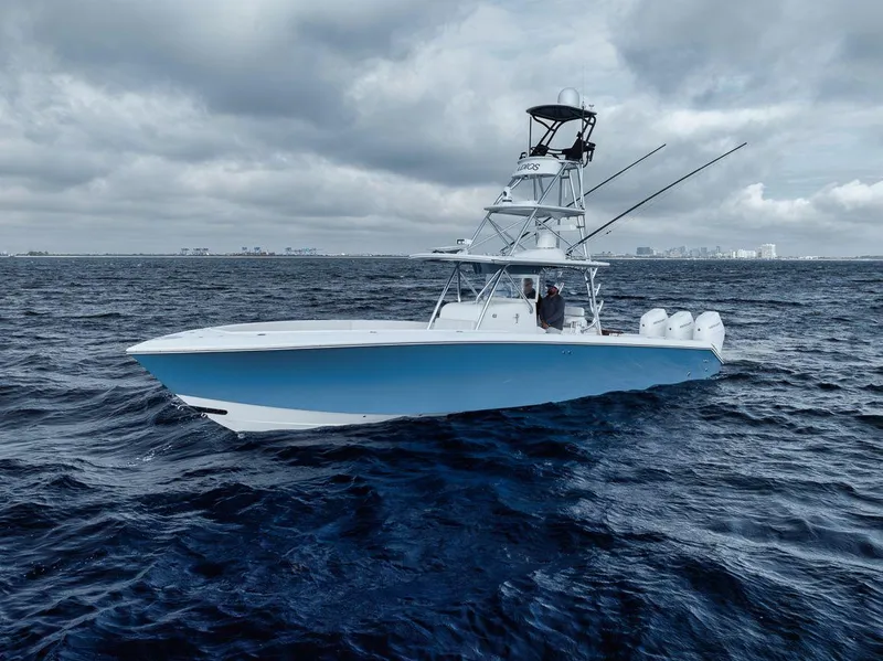 Slide: The Image of 2010 Bahama 41 boat on choppy ocean under cloudy sky. - 12