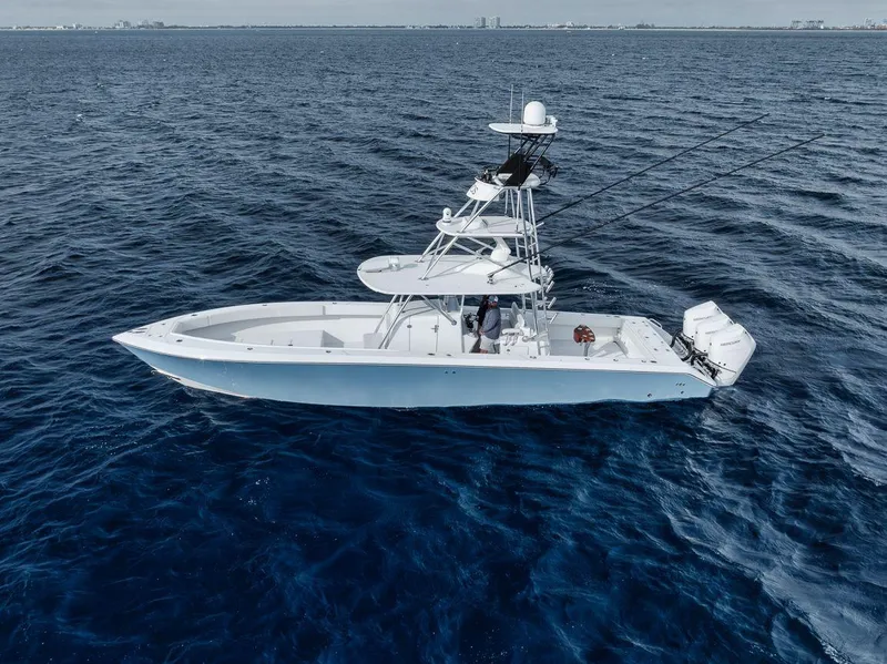 Slide: The Image of 2010 Bahama 41 boat cruising on open ocean waters. - 14