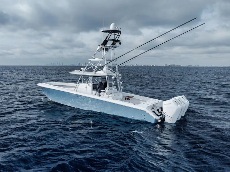 Slide: The Image of 2010 Bahama 41 boat on open ocean under cloudy sky. - 16